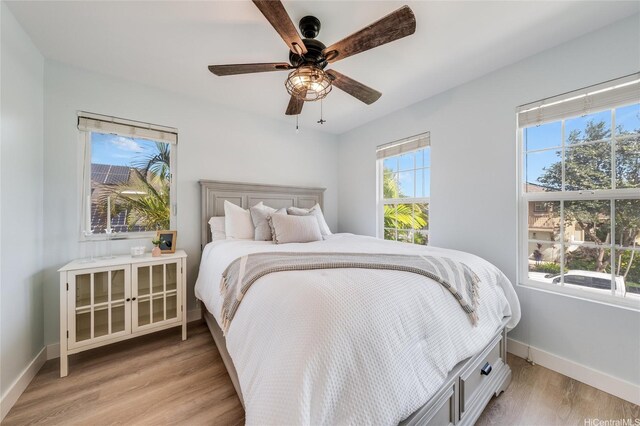 91-1180 Waiemi St, Ewa Beach, HI 96706 - bedroom featuring baseboards, light wood-style floors, and a ceiling fan