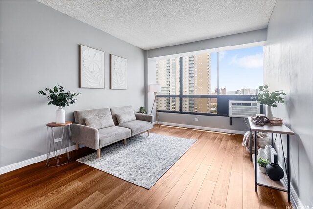 876 Curtis St Unit 3208, Honolulu, HI 96813 - living area featuring a textured ceiling, a view of city, and wood finished floors