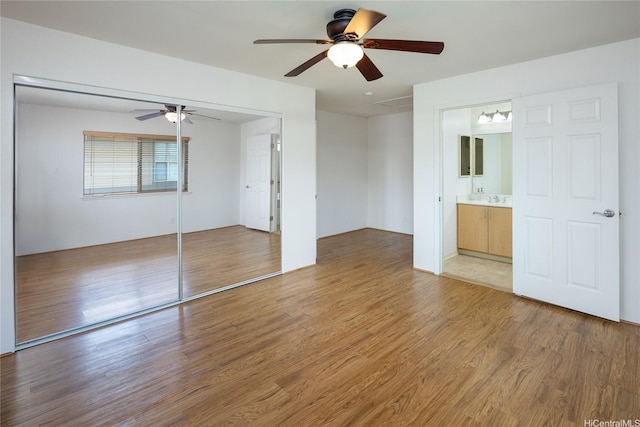 92-1199 Pueonani St, Kapolei, HI 96707 - unfurnished bedroom with a closet, light wood finished floors, ceiling fan, a sink, and ensuite bathroom