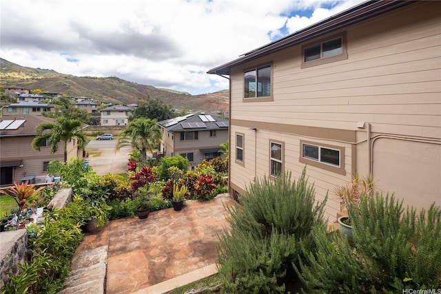 92-1199 Pueonani St, Kapolei, HI 96707 - view of home's exterior featuring a mountain view, a patio area, and a residential view