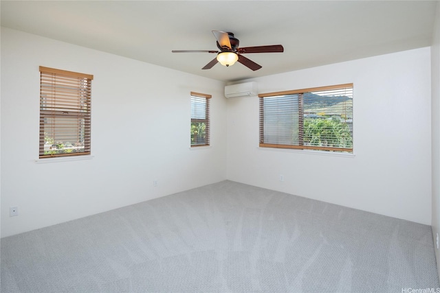 92-1199 Pueonani St, Kapolei, HI 96707 - carpeted spare room featuring a wall mounted air conditioner and a ceiling fan