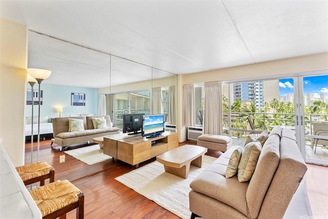 living area featuring wood finished floors and french doors