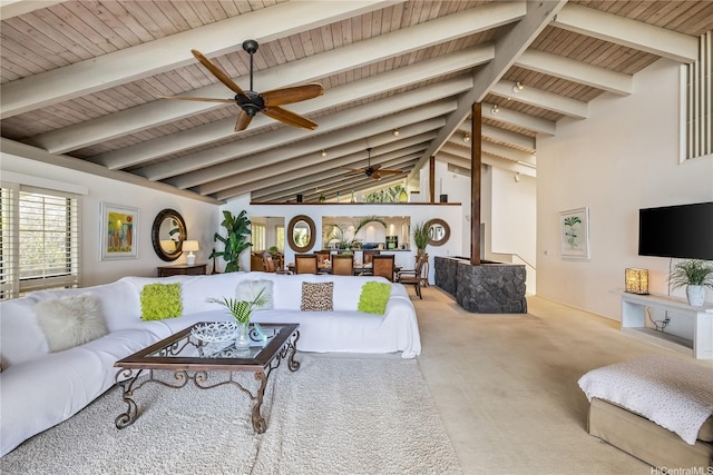 living area with wood ceiling, vaulted ceiling with beams, a ceiling fan, and carpet floors