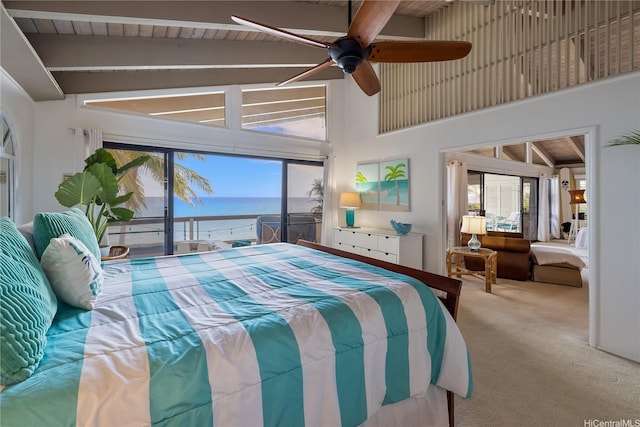 bedroom featuring a water view, ceiling fan, beamed ceiling, high vaulted ceiling, and carpet flooring