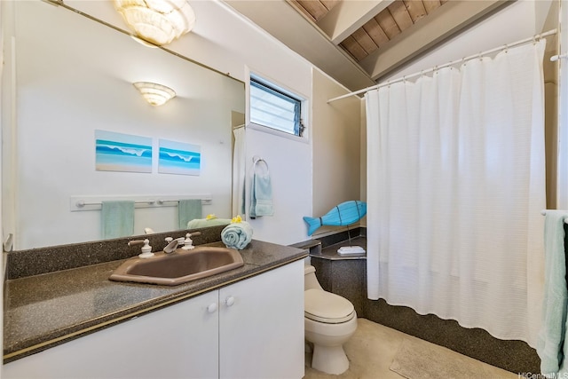 full bathroom featuring toilet, vanity, and lofted ceiling
