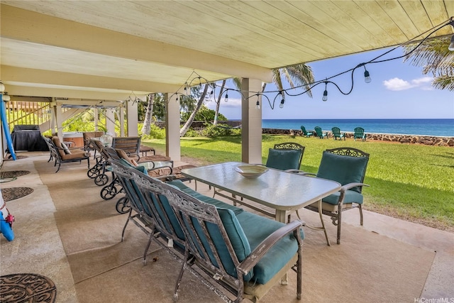 view of patio featuring outdoor dining area and a water view