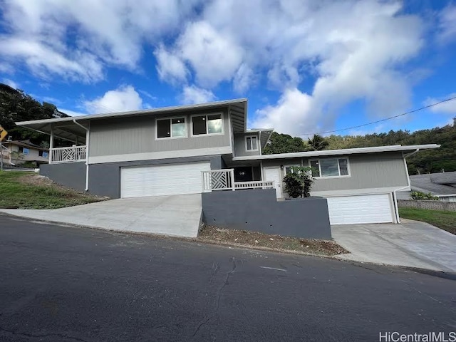 traditional-style home featuring driveway and an attached garage