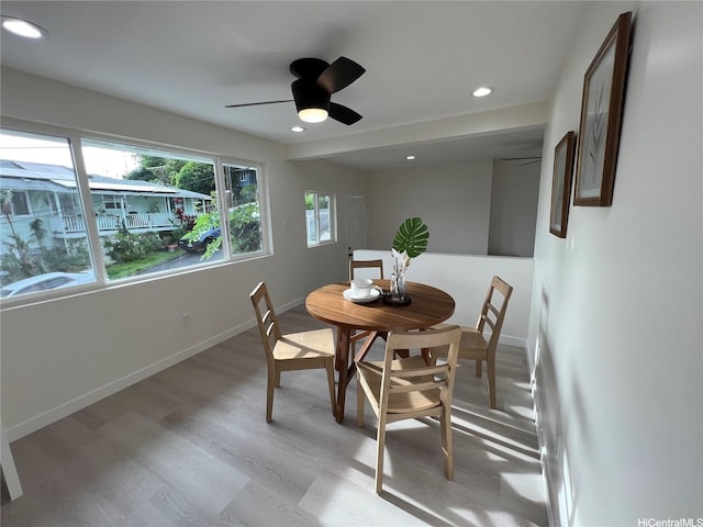 dining area with light wood-type flooring, a ceiling fan, baseboards, and recessed lighting