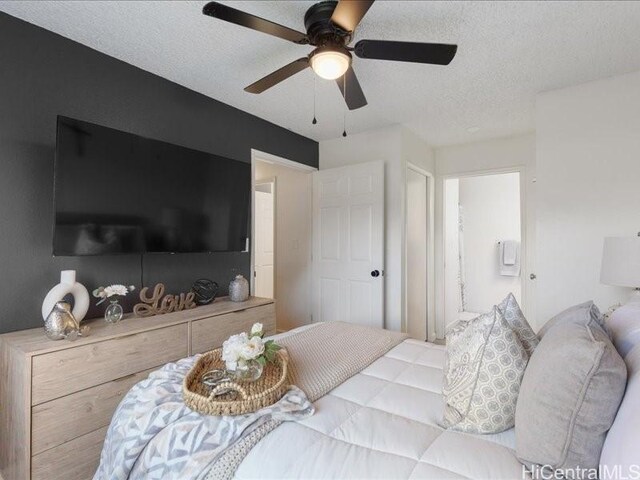 94-546 Kupuohi St Unit 104, Waipahu, HI 96797 - bedroom featuring a textured ceiling and a ceiling fan