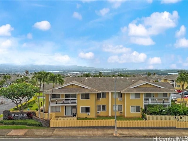 94-546 Kupuohi St Unit 104, Waipahu, HI 96797 - exterior space with a fenced front yard and a balcony