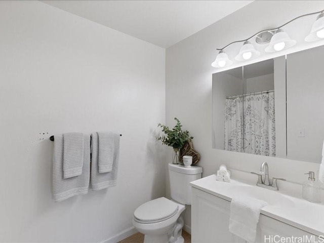 94-546 Kupuohi St Unit 104, Waipahu, HI 96797 - bathroom with toilet, vanity, and baseboards