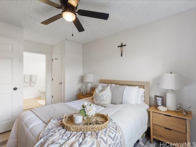 94-546 Kupuohi St Unit 104, Waipahu, HI 96797 - bedroom featuring a textured ceiling, ceiling fan, and connected bathroom