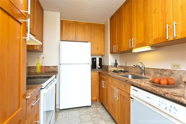 3161 Ala Ilima St Unit 1515, Honolulu, HI 96818 - kitchen with brown cabinets, a sink, white appliances, light stone countertops, and a textured ceiling