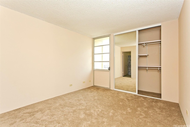 3161 Ala Ilima St Unit 1515, Honolulu, HI 96818 - unfurnished bedroom featuring a textured ceiling, carpet, and a closet