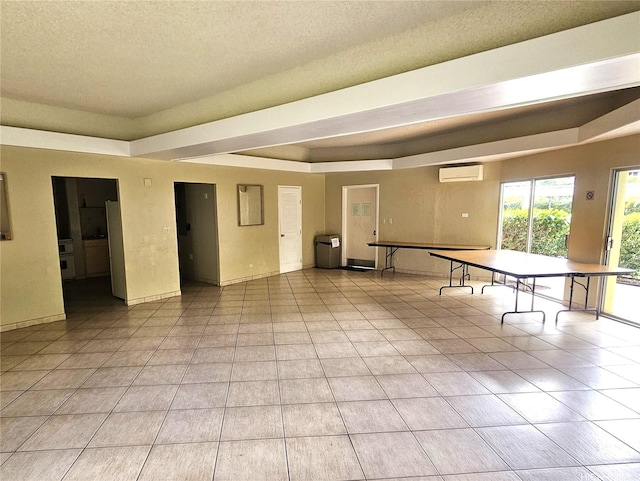 3161 Ala Ilima St Unit 1515, Honolulu, HI 96818 - playroom with a tray ceiling, a textured ceiling, light tile patterned floors, and a wall mounted air conditioner