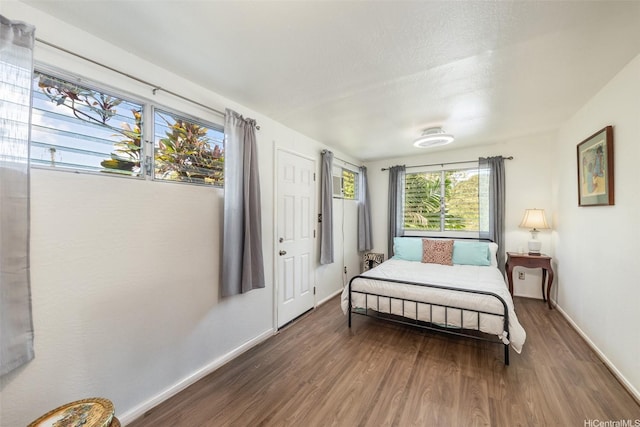 2168 Round Top Dr, Honolulu, HI 96822 - bedroom featuring baseboards and wood finished floors