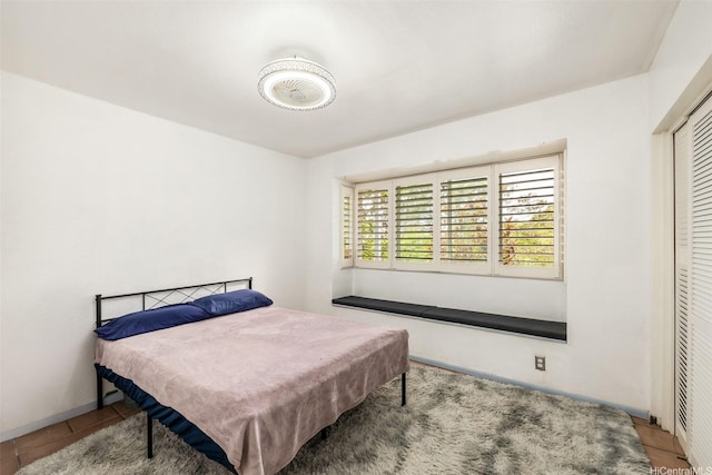 2168 Round Top Dr, Honolulu, HI 96822 - bedroom with tile patterned flooring and a closet