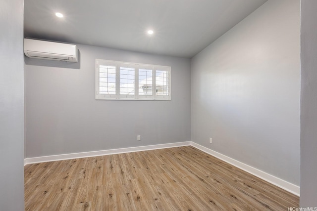 914 Lemiwai St, Wahiawa, HI 96786 - empty room featuring an AC wall unit, light wood-type flooring, and recessed lighting