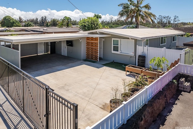 914 Lemiwai St, Wahiawa, HI 96786 - rear view of house with an attached carport and concrete driveway