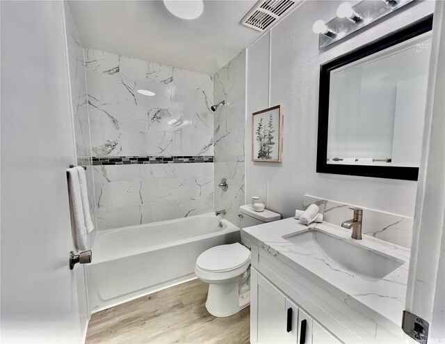 85-114 Ala Walua St Unit F, Waianae, HI 96792 - bathroom with toilet, wood finished floors, shower / bath combination, and vanity