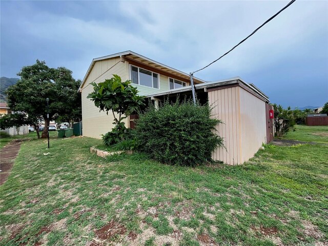 85-114 Ala Walua St Unit F, Waianae, HI 96792 - view of side of home featuring a yard