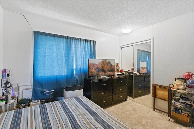 92-1327 Panana St Unit 49, Kapolei, HI 96707 - bedroom featuring light carpet, a textured ceiling, and a closet