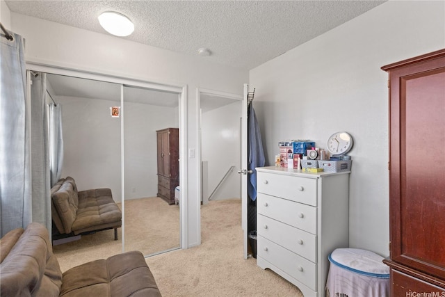 92-1327 Panana St Unit 49, Kapolei, HI 96707 - bedroom with light colored carpet, a textured ceiling, and a closet