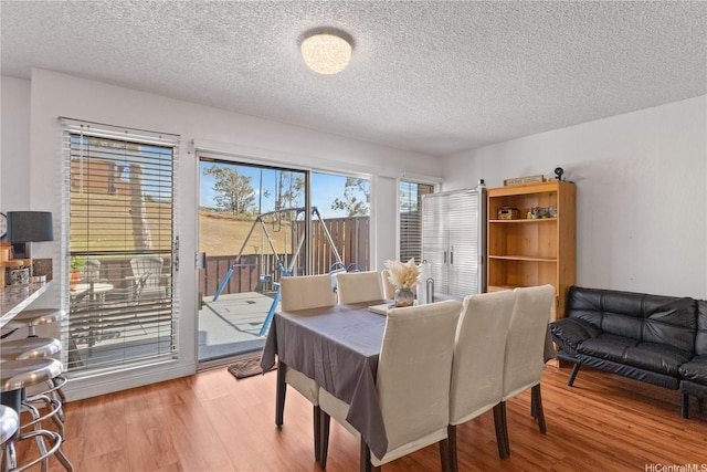 92-1327 Panana St Unit 49, Kapolei, HI 96707 - dining area with wood finished floors and a textured ceiling