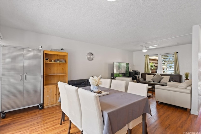 92-1327 Panana St Unit 49, Kapolei, HI 96707 - dining area featuring a textured ceiling, light wood-style flooring, and ceiling fan