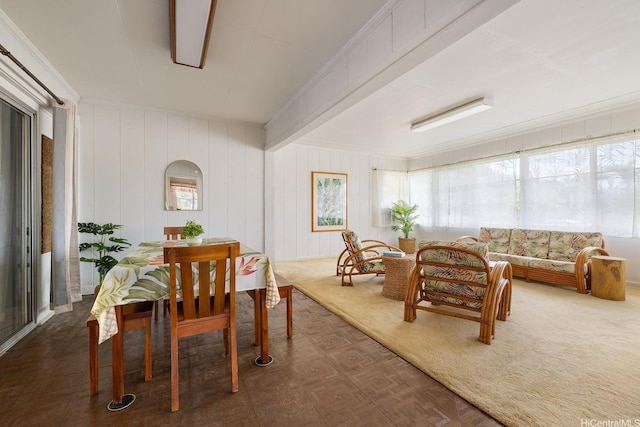 dining room with beam ceiling
