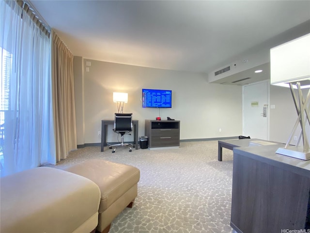 living room featuring baseboards, carpet floors, and visible vents