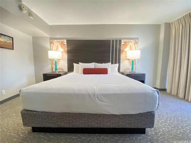 bedroom featuring carpet floors and baseboards