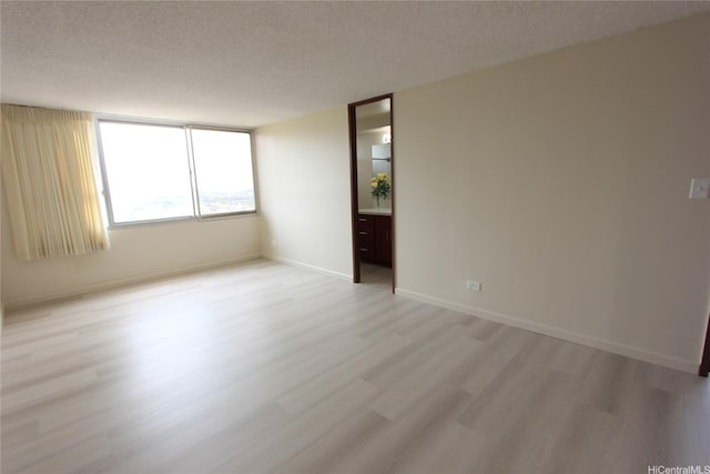 98-288 Kaonohi St Unit 3802, Aiea, HI 96701 - unfurnished room with light wood finished floors and a textured ceiling