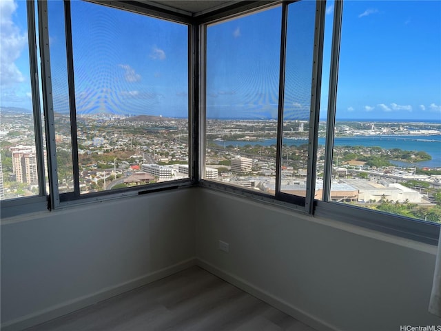 98-288 Kaonohi St Unit 3802, Aiea, HI 96701 - spare room featuring wood finished floors, a view of city, and a water view