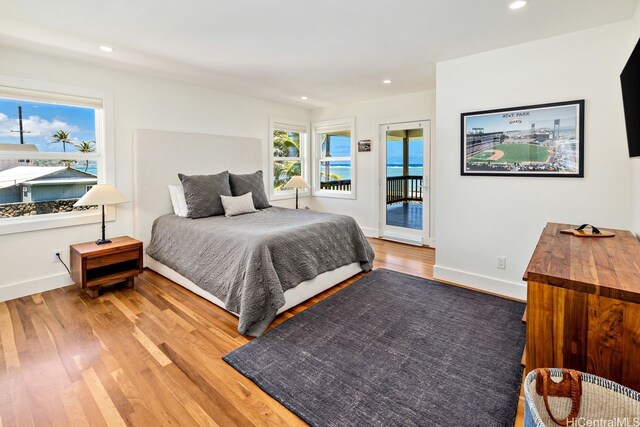53-926 Kamehameha Hwy, Hauula, HI 96717 - bedroom with access to outside, baseboards, recessed lighting, and wood finished floors