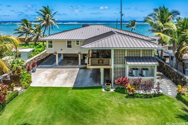 53-926 Kamehameha Hwy, Hauula, HI 96717 - back of property featuring a yard, a carport, concrete driveway, and metal roof