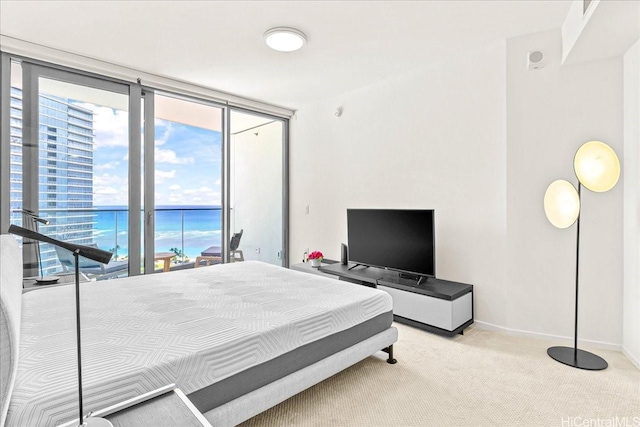 1000 Auahi St Unit 2410, Honolulu, HI 96814 - carpeted bedroom with access to exterior, baseboards, and floor to ceiling windows