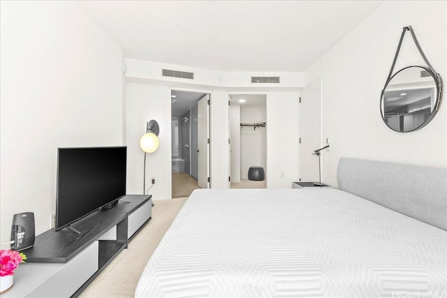 1000 Auahi St Unit 2410, Honolulu, HI 96814 - bedroom with light carpet, ensuite bathroom, and a walk in closet