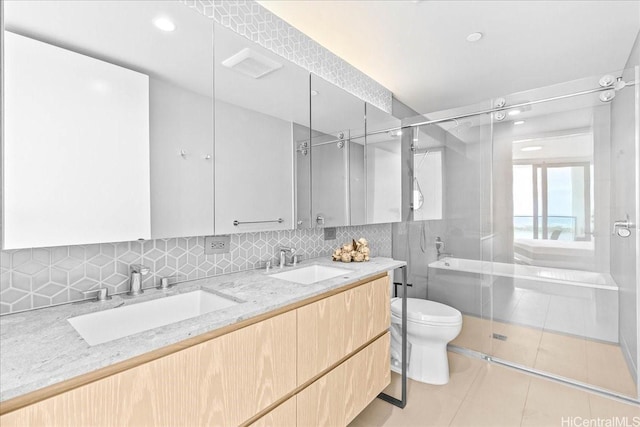 1000 Auahi St Unit 2410, Honolulu, HI 96814 - full bathroom featuring a stall shower, toilet, tile patterned floors, double vanity, and tasteful backsplash