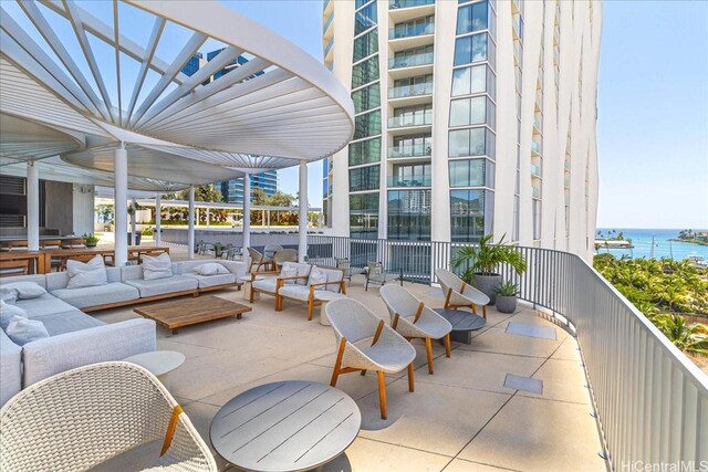 1000 Auahi St Unit 2410, Honolulu, HI 96814 - view of patio with a water view and an outdoor living space