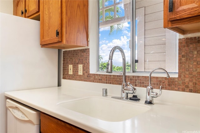 94-608 Lumiaina St Unit S201, Waipahu, HI 96797 - kitchen featuring plenty of natural light, light countertops, dishwasher, and brown cabinets