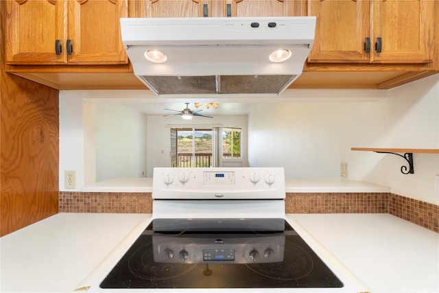 94-608 Lumiaina St Unit S201, Waipahu, HI 96797 - kitchen with light countertops, a ceiling fan, under cabinet range hood, and white range with electric cooktop
