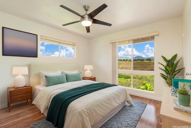 94-608 Lumiaina St Unit S201, Waipahu, HI 96797 - bedroom featuring baseboards, a ceiling fan, and wood finished floors