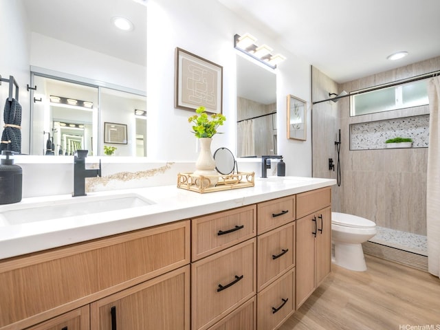 1129 Ala Aloalo St, Honolulu, HI 96818 - bathroom featuring double vanity, toilet, tiled shower, and a sink