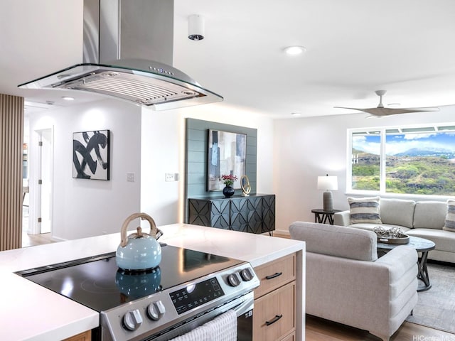 1129 Ala Aloalo St, Honolulu, HI 96818 - kitchen featuring open floor plan, light countertops, island range hood, and stainless steel electric range oven