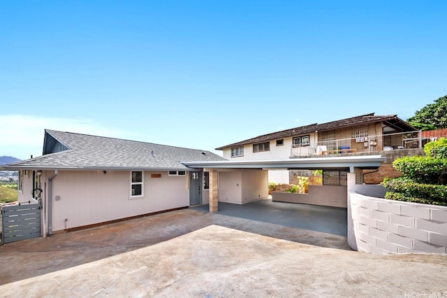 1129 Ala Aloalo St, Honolulu, HI 96818 - view of front of property with driveway, an attached carport, and a shingled roof