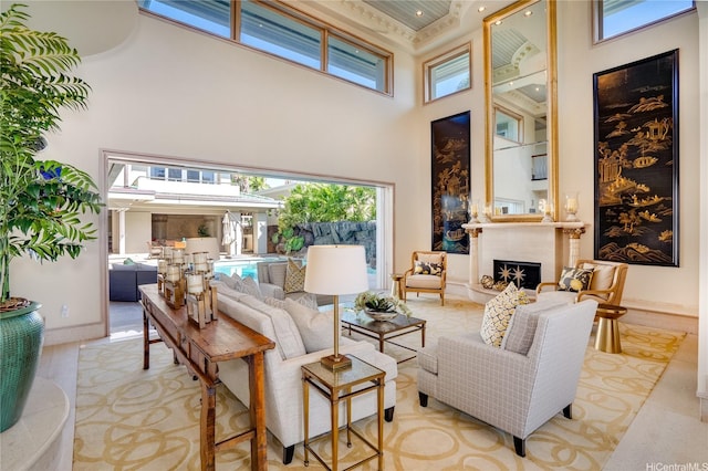 4504 Kahala Ave, Honolulu, HI 96816 - living area with a fireplace, baseboards, and a towering ceiling