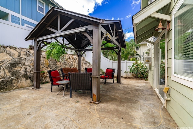 view of patio / terrace with a fenced backyard and a gazebo
