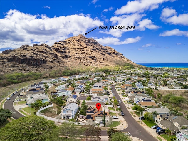 aerial view with a water and mountain view and a residential view