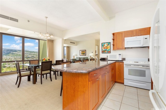 229 Paoakalani Ave Unit 3801, Honolulu, HI 96815 - kitchen featuring a chandelier, visible vents, white appliances, beam ceiling, and a peninsula